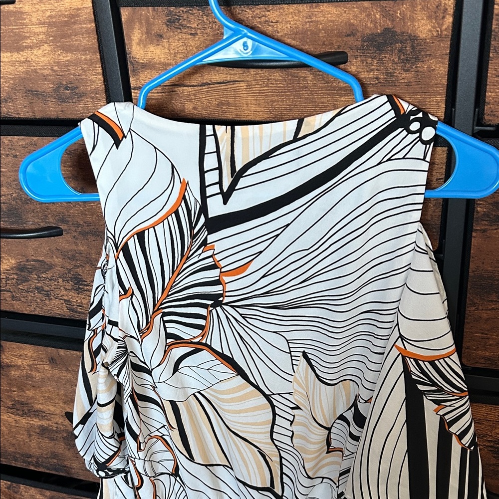 Adelyn Rae Black and Orange Patterned Romper - Picture 8 of 9